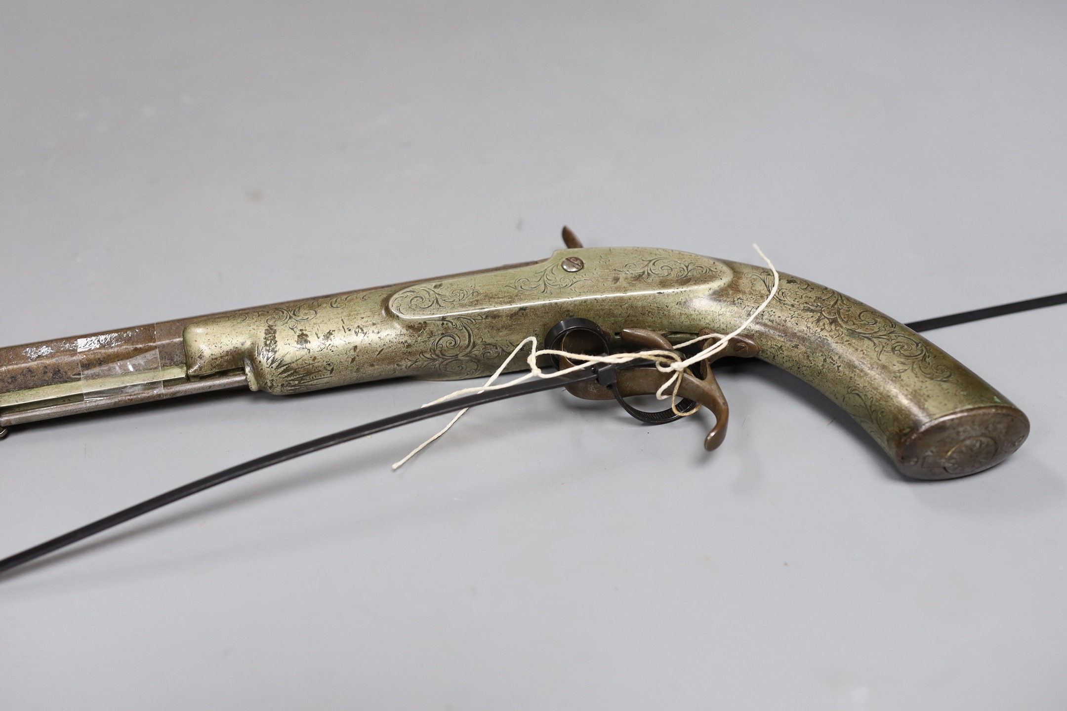 A 19th century Continental engraved brass and steel percussion pistol,32 cms long